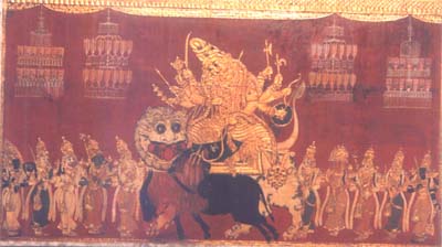 Durga assisted by Goddesses killing Mahishasura.